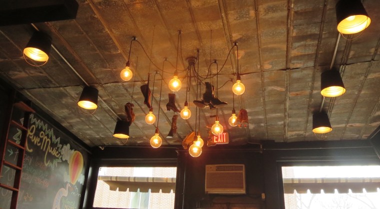 Quirky shoe chandelier at Shoe's Cup and Cork