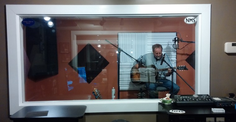 Clark Hansbarger of the Bitter Liberals lays down a guitar track in the new room.