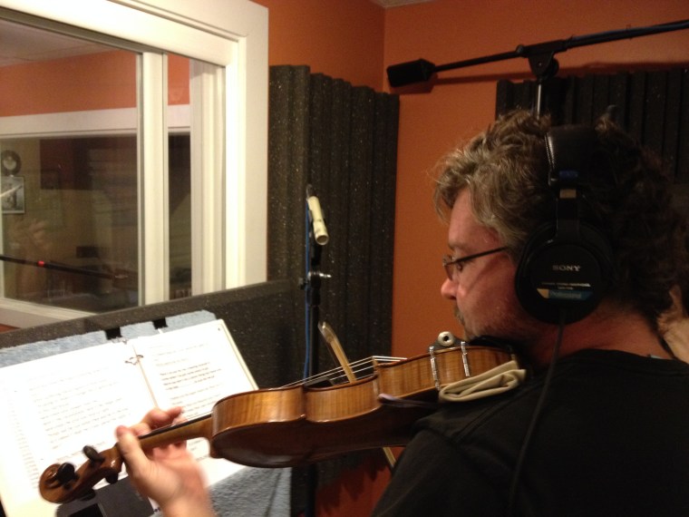 Gary McGraw of the Bitter Liberals plays some fiddle.