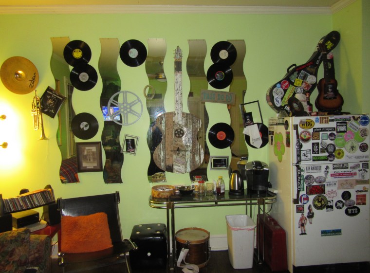 Wall o records with signed guitar art